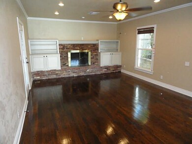 Den/Family/Great Room. Custom solid wood built ins,  custom built for audio/video equip. Wired for surround sound and HDMI wired