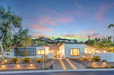 Wide shot of front of house from across