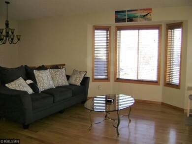 Beautiful maple floors in the living room with gre