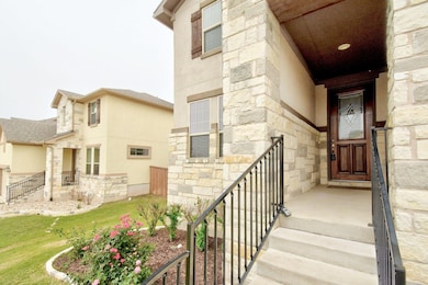 Doorway to property with stone siding and stucco 
