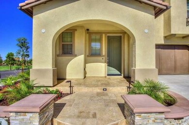 A distinctive covered-porch entry leads to an open