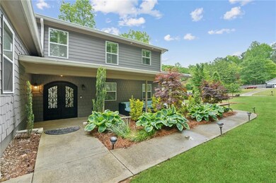 Entrance to property with a porch and a yard