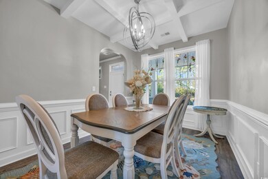 Dining room featuring a chandelier, beam ceiling, 