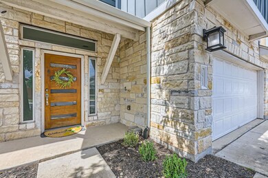Property entrance featuring board and batten sidi