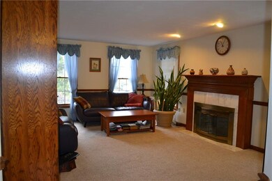 Family room with fireplace, chair rail and new car