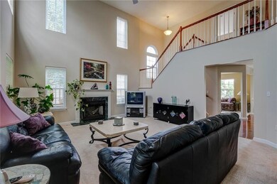 This dramatic two-story living space is the center