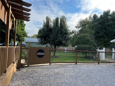View of gate featuring a yard