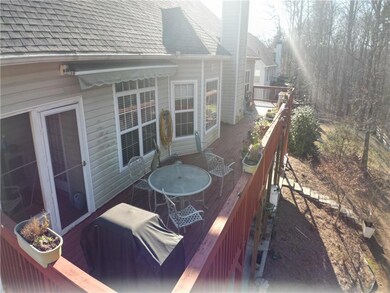 Deck with outdoor dining area and grilling area