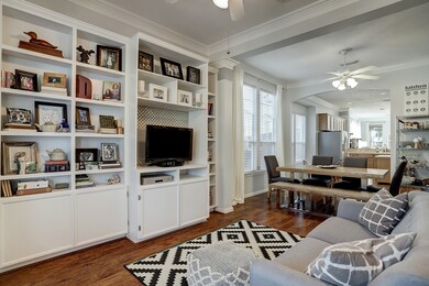 Another view of the flex room looking back past the dining room into the open kitchen. The sellers updated the paint to colors that allow most buyers to eliminate re-painting as a future expense.