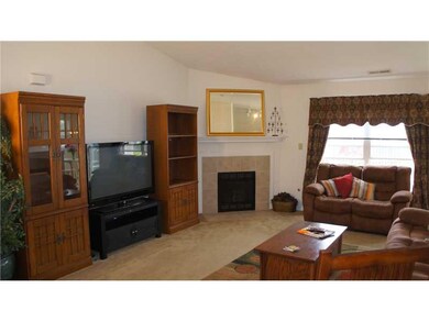 Great Room. Gas log fireplace with tile surround.