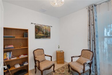 Sitting room featuring baseboards and light tile patterned floors