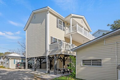 Rear view of property with a balcony