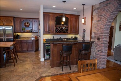 Adjoining the kitchen is a 7 foot wet bar with win