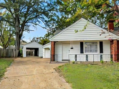View of front of property featuring an outbuilding