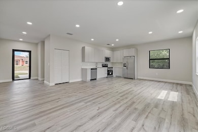 Unfurnished living room featuring plenty of natura