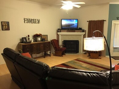 view of gas log fireplace, high ceilings with deta