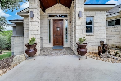 Property entrance with stone siding