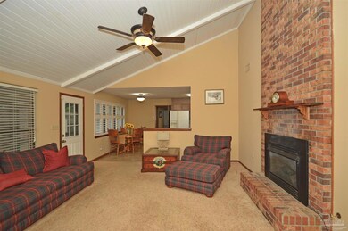 large brick fireplace, bead board ceiling