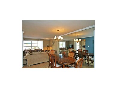 Mirrored dining room with classic chandelier for f