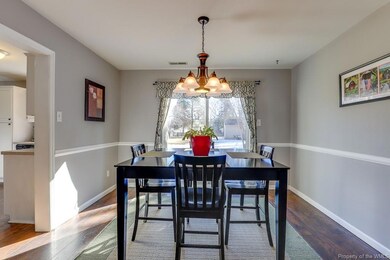 Dining area with view of sliding patio doors to ba