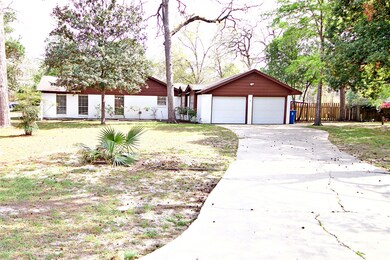 Side 2 car garage and additional parking