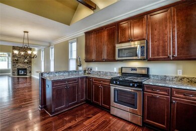 Gourmet kitchen provides cherry cabinetry with Cam