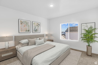 Carpeted bedroom with baseboards