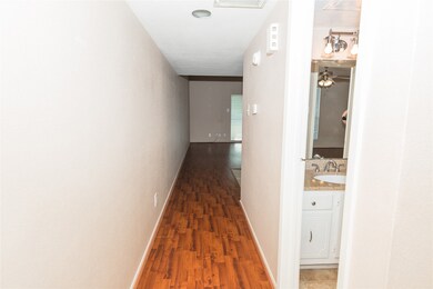 Entry foyer leads to living area with bathroom and