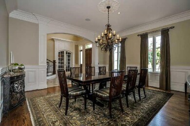 The formal Dining Room is perfect for entertaining.  It features hardwood floors,  a medallion chandelier, crown molding and French doors.