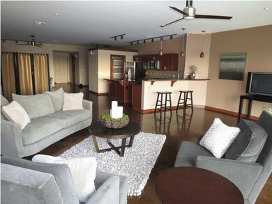 Kitchen opens to the large living area overlooking