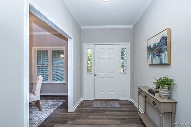 Foyer entrance featuring LVP flooring and ornament