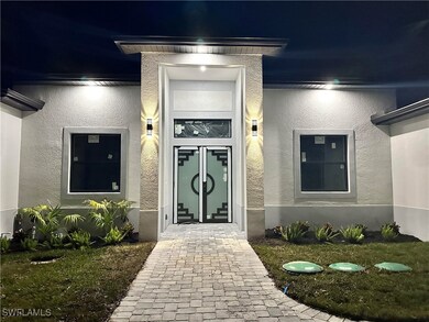 View of exterior entry at night