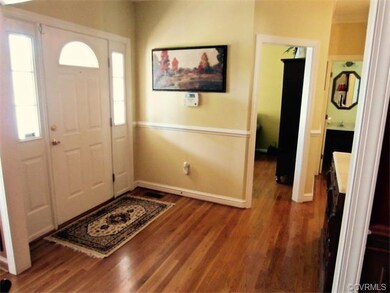 The Welcoming Foyer offers a Front Door with Sidel