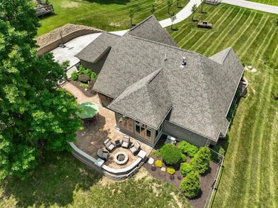 Extensive hardscaping in the back offers great entertaining space.
