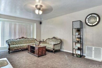 Large living room with a large window 