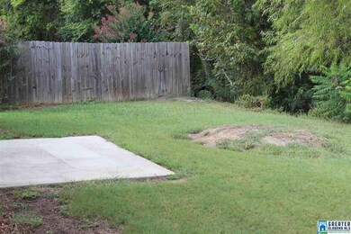 BACK YARD THAT ADJOINS THE WOODS GIVING YOU LOTS O