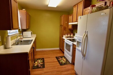 Galley kitchen sits right off of dining area. 