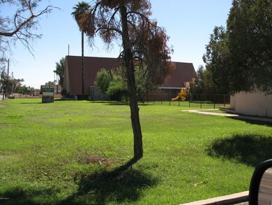 Front lawn area, fenced playground