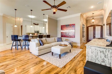 Den area has beautiful wood floors, triple crown m