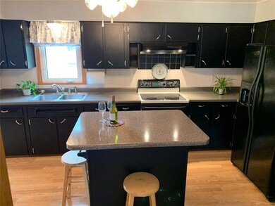 Kitchen complete with appliances & island.  Looks