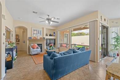 Living room with light tile patterned floors, a ce