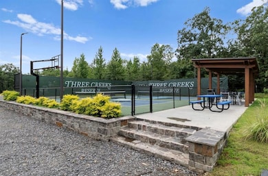 Surrounding community with a tennis court