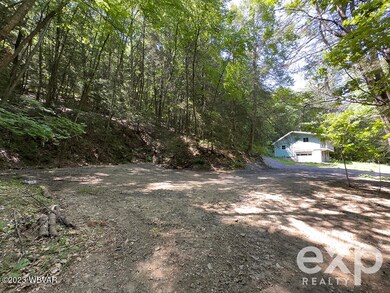 East Side of House with Large Driveway