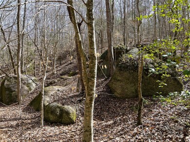 Huge boulder outcropping along the creek bottom