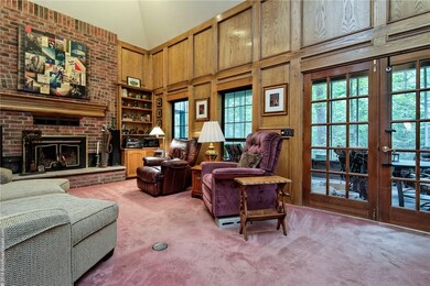 Brick fireplace in the sitting room next to the sc