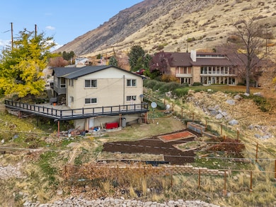 View of subject property featuring a mountain backdrop