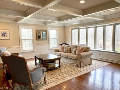 Family room with wood floors and bright bayed wind