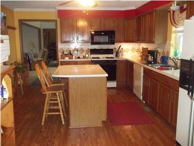 Kitchen with center island and eating bar