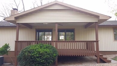 Exterior back view of the home & deck.