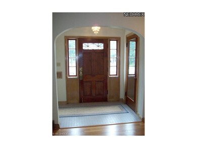 The foyer welcomes you into this home with a coat 